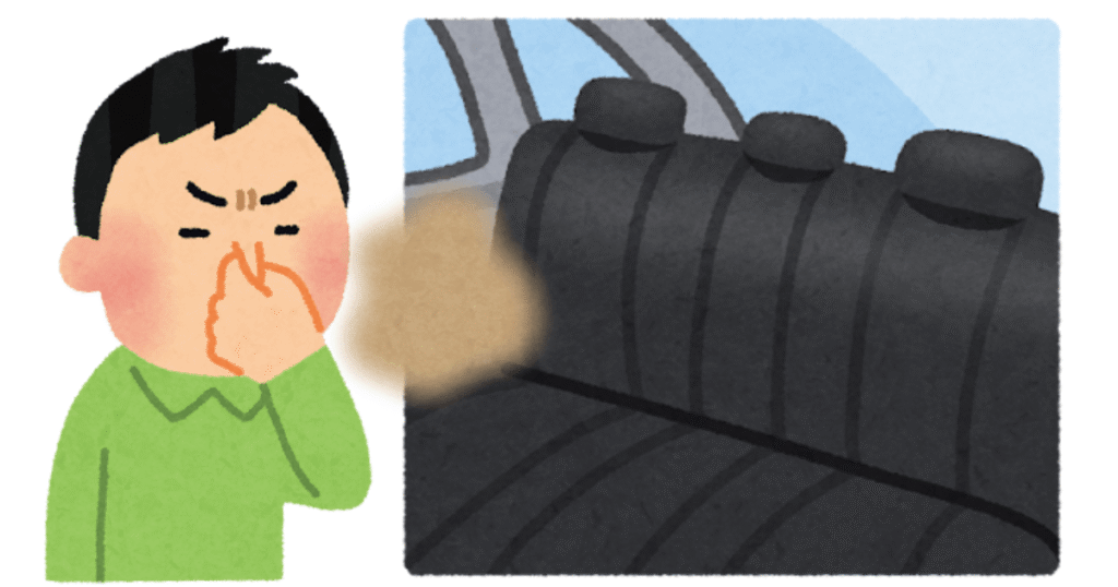 車内の匂いが臭くて鼻を摘んでいる男性